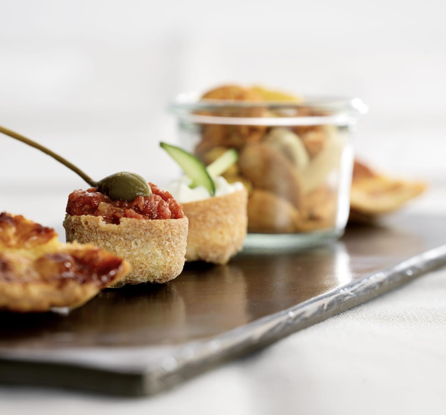 The image shows appetizers on a tray.