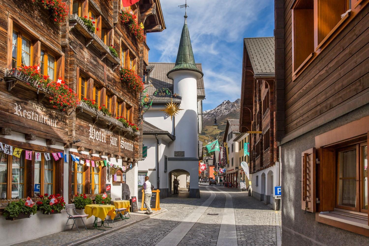 The image shows the snow-covered town of Andermatt.